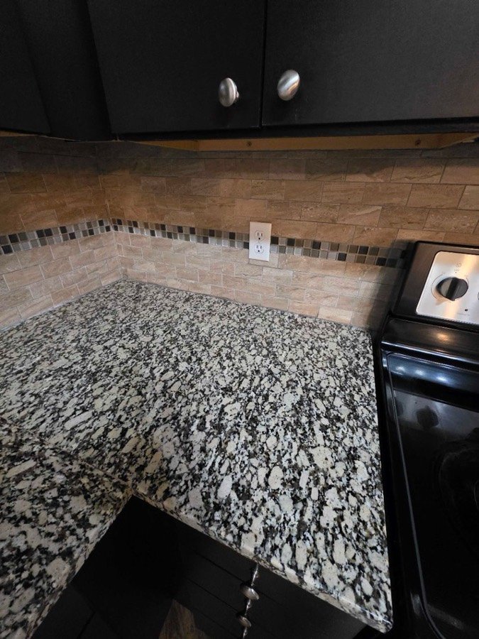 Kitchen counter and backsplash after house cleaning in Overland Park, KS